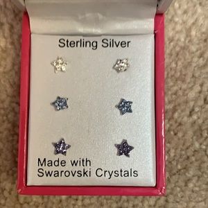 Three pairs of star earrings never worn